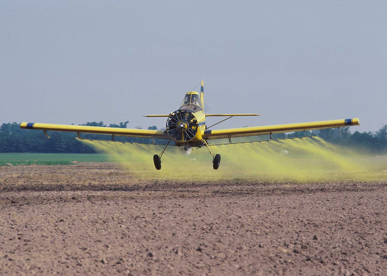 crop duster spraying field