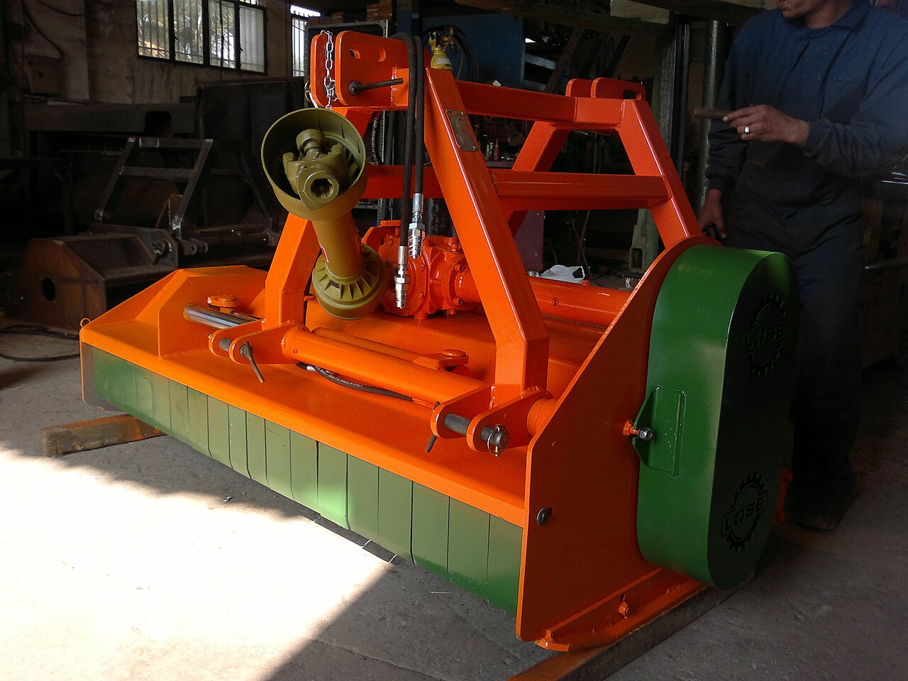 orange and green agricultural machinery
